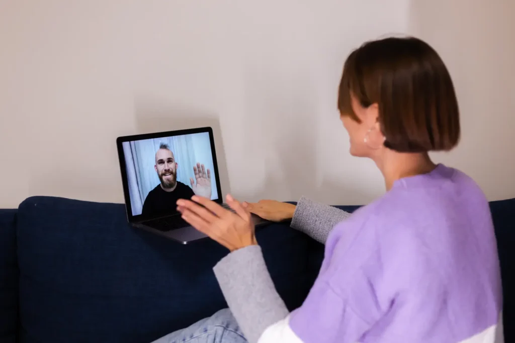 Virtual Physiotherapy 1 woman at home face time video call her friends hus 2024 10 18 07 46 08 utc