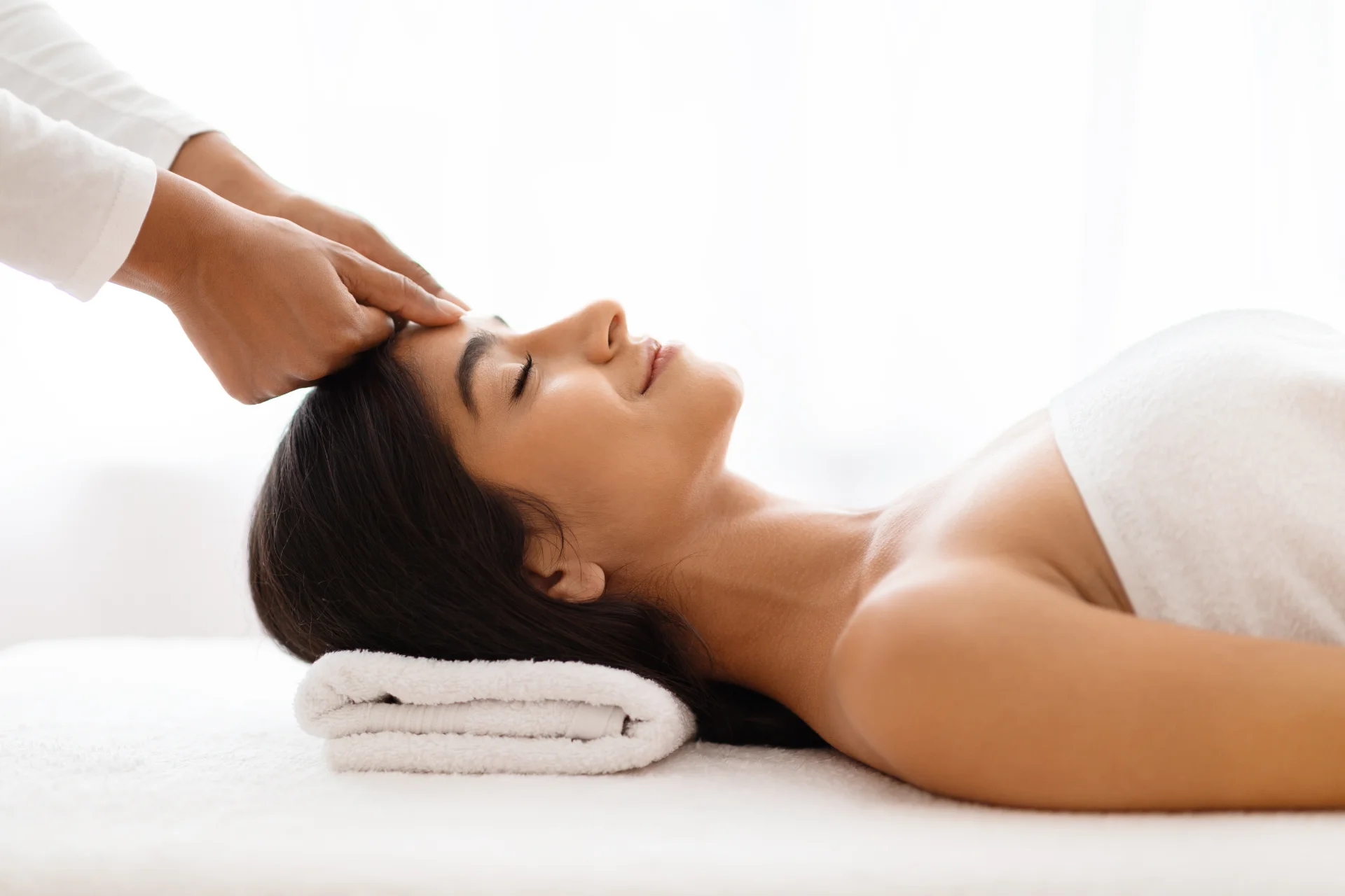 professional masseur soothes the brow of young ind 2026 03 24 23 48 28 utc