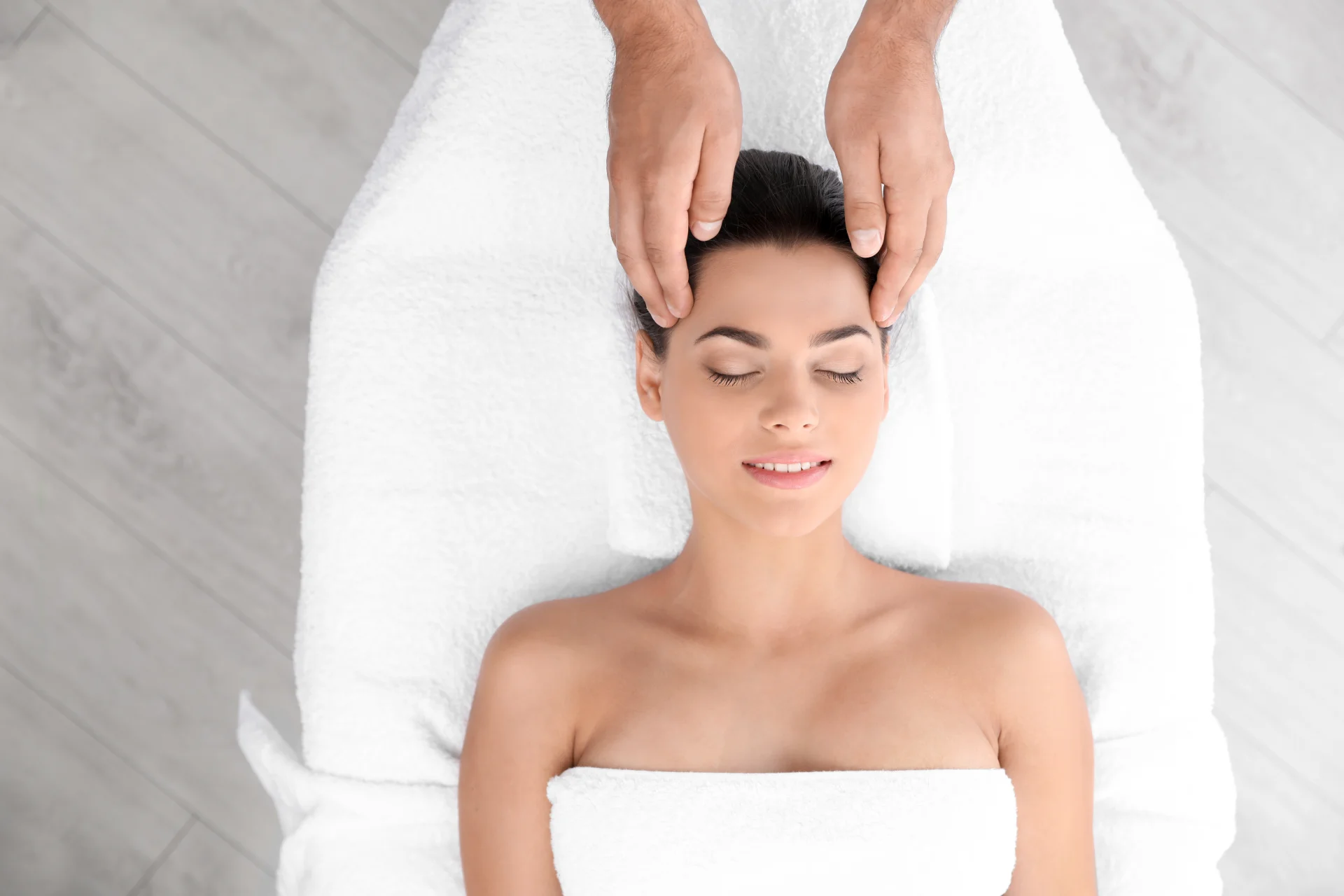 relaxed woman receiving head massage in wellness c 2026 03 05 11 50 46 utc